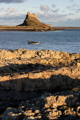 Wall Mural - Stunning dramatic landscape image of Lindisfarne, Holy Island in Northumberland England during Winter