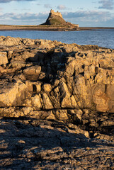 Wall Mural - Stunning dramatic landscape image of Lindisfarne, Holy Island in Northumberland England during Winter