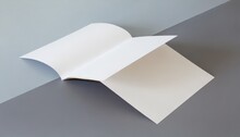 Blank Half Fold Brochure Template For Your Presentation Over Grey Background