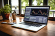 Laptop with stock market chart on screen. Business and financial concept.