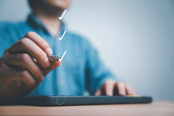 Fototapete - Businessman using pen tick correct sign mark on checkbox for quality document control checklist and business approve project concept.