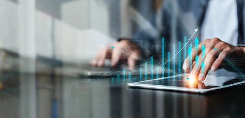 Businessman analyzing financial profit and economic growth graph chart. growth graph of business and blockchain technology Data analysis, Business planning and strategy concept.