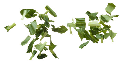 Wall Mural - Chopped Kale fly in mid air, green fresh vegetable chinese kale falling. Organic fresh vegetable with eaten leaf of chinese kale, heap close up texture. White background isolated freeze motion