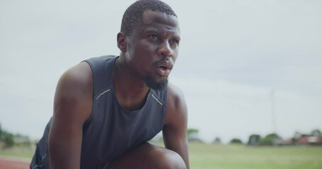 Canvas Print - Black man, start and running for fitness, training or outdoor exercise in competition on stadium track. Face of Active African male person or athlete ready for race, sprint or marathon in Olympics