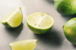 sliced limes on a gray