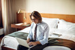 © Marko Geber - Mature businessman using a laptop in a hotel room