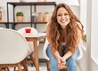 © Krakenimages.com - Young beautiful hispanic woman smiling confident sitting on chair at home