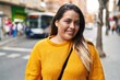 © Krakenimages.com - Young beautiful plus size woman smiling confident standing at street