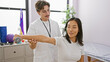 © Krakenimages.com - A man therapist assists a woman patient with dumbbell exercises in an indoor rehabilitation clinic.