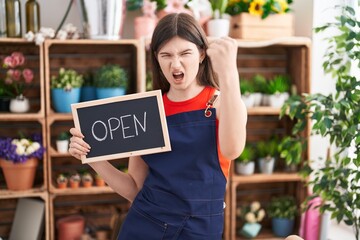 Canvas Print - Young caucasian woman working at florist holding open sign annoyed and frustrated shouting with anger, yelling crazy with anger and hand raised