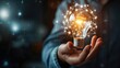 © Orxan - Businessman hand holding creative light bulb with industry network, analysis solution and development marketing network icons planning strategy, Modern business, Innovative of new ideas