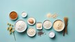 Top-down view of baking ingredients on a pastel blue background, arranged neatly with a sense of minimalism