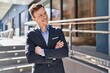 © Krakenimages.com - Young man business worker smiling confident standing with arms crossed gesture at street