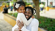African american father and daughter smiling confident hugging each other at park