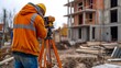 Construction site worker using theodolite to survey distances, elevations, and directions.