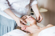 © Dasha Petrenko - Young woman have face treatment at beauty clinic