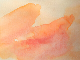 Abstract watercolor in pastel peaches and apricots creates a beautiful muted colored background