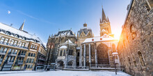 The Famous Huge Gothic Cathedral Of The Emperor Karl In Aachen Germany During Winter Season With Snow At Katschhof Against Blue Sky And Sunshine Background