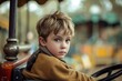 © LadiesWin - Young Boy Pensive on a Vintage Carousel Ride