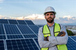 © Alan - portrait of an engineer smiling confident standing in front of solar panels, professional technician looking at camera, concept of renewable energy, photovoltaic cell electricity
