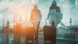 © YURII - Silhouette of business people walking in airport terminal. Travel and tourism concept. Double exposure