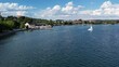 Aerial drone view of yacht on Starnberg See lake, Bavaria Germany. Recreation and relaxation area with beach, cafe and forest.