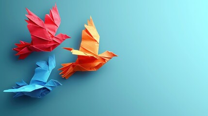 Poster -  a couple of origami birds sitting on top of a blue and green table top next to each other.