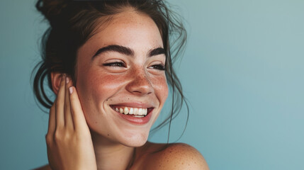 Sticker - Smiling woman with a hand gently touching her face, displaying clear skin and a joyful expression.