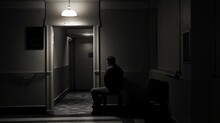 Depressed Person Alone In A Dark Room