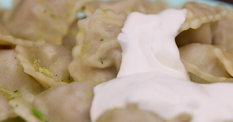 Wall Mural - small dumplings with wheat flour and pieces of meat, cooked dumplings close-up