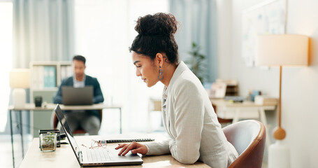 Fototapete - Woman with desk, laptop and typing in coworking space, market research and online schedule at consulting agency. Office, admin business and girl at computer writing email review, feedback or report.