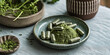 Natural Organic Moringa Powder and Capsules on Ceramic Plate. Natural moringa green leaf powder and herbal supplements in a serene setting.