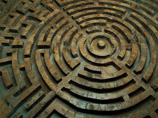 Rustic metal labyrinth design. Historical maze pattern for cultural and archeological interests. Symbol of complexity and ancient art.
