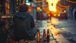 Depressed man drinking alcohol outdoors in the evening