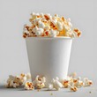 white cup with popcorn. bucket of popcorn