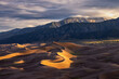 © Erika Valkovicova - Sunrise in Great Sand Dunes National Park in Colorado with mountains in the background