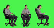 © DC Studio - Asian adult enjoying video games over full body greenscreen, using controller and having fun with colleagues on online gaming contest. Young guy gamer playing multiplayer gameplay.