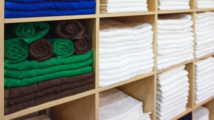 Leinwandbilder - Multi-colored towels on a shelf in a store