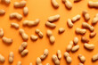 Generative AI Image of Top View of Shell Peanuts on Orange Background