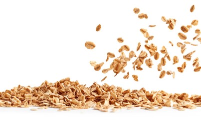 Wall Mural - Falling oat granola, crunchy muesli isolated on white background.