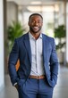 © CraftyImago - African American businessman in formal wear portrait of confident businessman in the modern office.