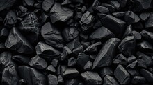 A High-resolution Image Displaying A Variety Of Black Stones With Different Textures And Shapes, Creating A Natural, Monochromatic Background