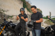 © Odua Images - indonesian riders preparing riding motorcycle wearing helmet and gloves