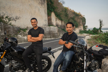 Wall Mural - asian men sitting on motorcycle with crossed arms