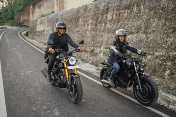 Canvas Print - indonesian riders on jacket and helmet traveling on the street by motorbike