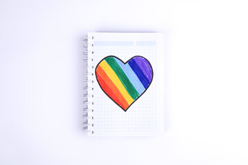 Photograph on light background of hand drawn LGBTQ+ heart. Concept of people and lifestyles.