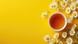 A cup of delicious chamomile tea positioned on a yellow background, with designated space for text, Ai Generated.