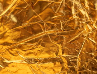 Wall Mural - Crumpled gold background as an abstraction. Texture