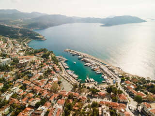 Wall Mural - A resort area with sea, beach, houses and hotels. Beautiful nature at sunset. A bird's-eye view, a photo from a drone.