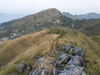 Wall Mural - Aerial view of Doi Pha Tang a viewing point on top of a high cliff over the Thai-Laotian border located in Wiang Kaen district of Chiang Rai province of Thailand.